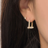 Noi Arch White Huggie Earrings ELKS4184